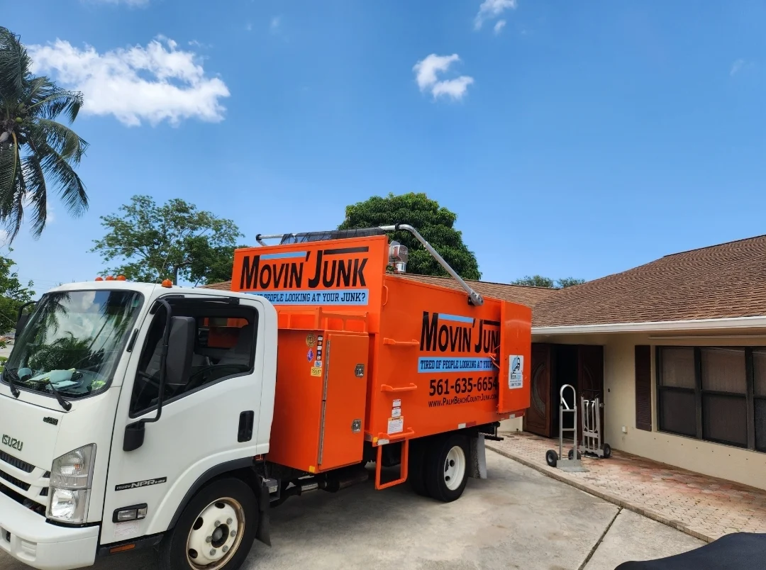 Movin' Junk truck at a residential job site
